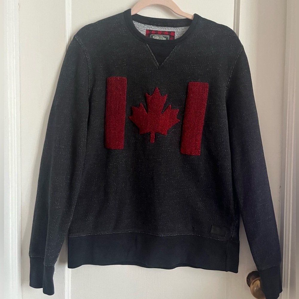 Roots Unisex Holiday Sweatshirt with Fuzzy Canadian Flag